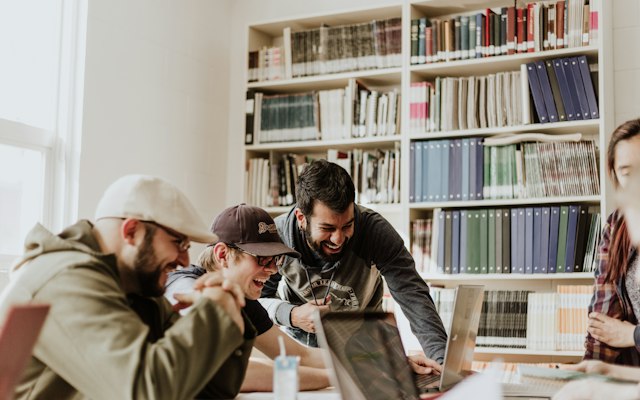 Students learning together in a library