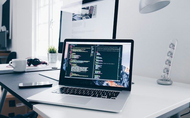 Website code open on a laptop